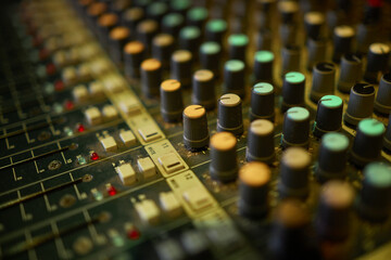 View of music mixer in concert, filled with lights.