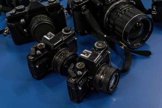 Some iconic old black cameras - Powered by Adobe