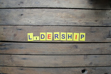 Leadership idea multi-colored letters lie on the table