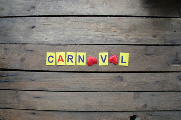 Carnival idea multi-colored letters lie on the table