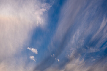 cirrus clouds at sunset. blue sky.