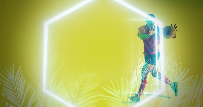 Illuminated hexagon and plants over african american rugby player catching ball on yellow background