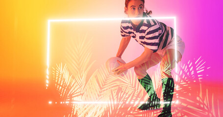 Caucasian female rugby player with ball bending over illuminated rectangle and plants
