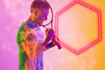 Side view of excited african american male player with racket shaking fist by illuminated hexagon