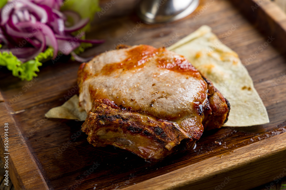 Poster Fried pork loin with sauce macro close up