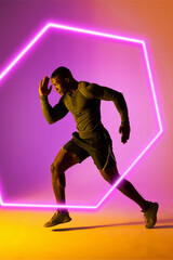 Fototapeta na wymiar Illuminated hexagon and african american male athlete running over against gradient background