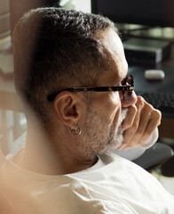 Portrait of middle age man with earrings and eyeglasses