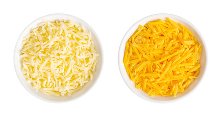 Shredded mozzarella and cheddar cheese, in white bowls. Grated low-moisture mozzarella, and...