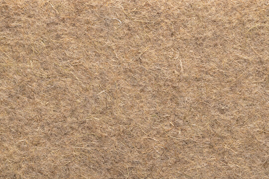 Hemp mat, surface and background, from above. Growth medium for growing microgreens. Industrial and natural hemp fibres, intertwined into a biodegradable and compostable alternative to growing soil.
