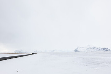 Road Leading Through the Frozen Snowy Landscape of Southern Iceland in Winter