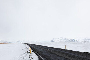Road LEading Through the Frozen Snowy Landscape of Southern Iceland in Winter