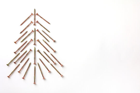 Top view of Christmas tree that made of screws gold-pink color, place for text
