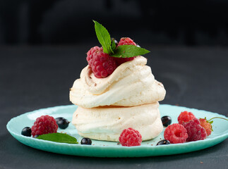 Baked cake made from whipped chicken protein and cream, decorated with fresh berries