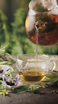 Herbal tea with hemp leaves on rustic background. Soothing natural remedy. CBD cannabioids in small amounts are healthy for physical and mental health