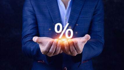 Businessman holding with percentage sign, monetary growth, interest rate increase, inflation...