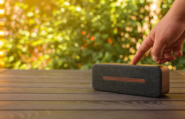 person playing speaker with bluetooth minimalist design - Powered by Adobe