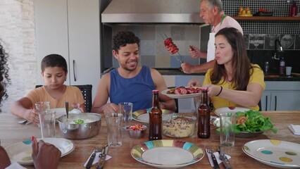 friends and family having a typical brazilian barbecue  churrasco. Happy  people gathering concept

