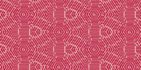 Seamless ikat geometric tribal hexagon and triangle textile surface pattern in Viva Magenta PANTONE 18-1750 color of the year for 2023.  Trendy crimson carmine red fashion design fabric background.