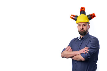 unshaven businessman wearing yellow protective construction helmet.