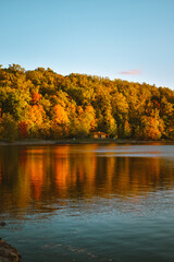 Autumn leaves reflecting on Cheat Lake in West Virginia, USA