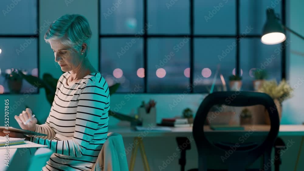 Aufkleber senior, woman and graphic designer working overtime while writing on a tablet in a creative design a