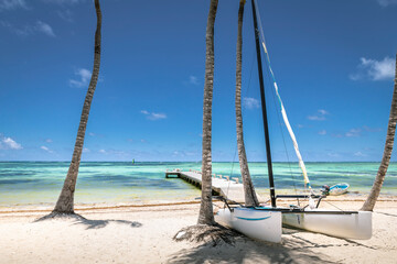 Idyllic Beach with boats and pier in Punta Cana, Bavaro, Caribbean sea