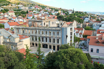 Fototapeta na wymiar Old destroyed building in downtown Mostar after Yugoslavian war