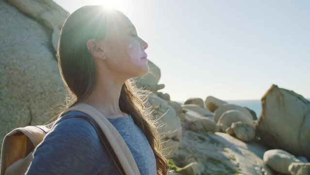 Woman, beach and relax with peace, vacation and happiness on adventure. Young female, lady and tourist enjoy view, seaside holiday and travelling for quality time, fresh air or breathing for wellness