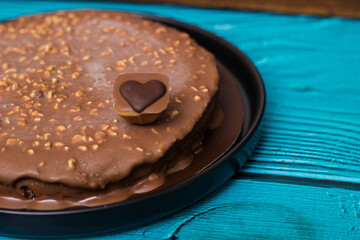 Delicious chocolate layer cake with toffee heart