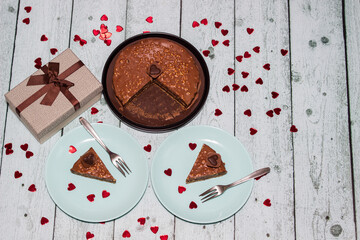Chocolate cake served for two with gift for Valentine's Day
