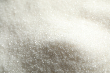 Pile of granulated sugar as background, closeup