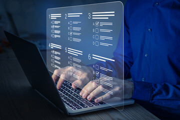 Online test, assessment or academic exam and answer multiple choice questions on computer screen. E-learning, remote student, survey, questionnaire, quiz on internet. MCQ. Person working on laptop.