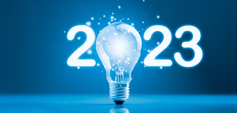 2023 lightbulb with glowing light sparkling effect. Concept of 2023 goals, ideas, target, business strategy, success, action plan, growth, market, development, investment, innovation technology. 