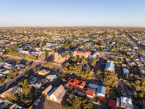 Early morning sunrise high angle aerial drone view of the Cathedral of the Sacred Heart of Jesus, a catholic church, and the historic outback mining town of Broken Hill, New South Wales, Australia.