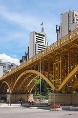 SAO PAULO - DECEMBER 07, 2017: Famous Santa Ifigenia Viaduct in downtown Sao Paulo on a sunny day with some people waiting for buses at the Bus Terminal located below the viaduct 