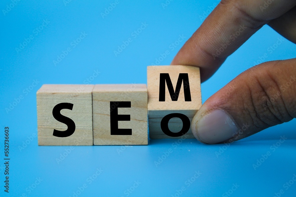 Poster wooden cube with the letters sem or seo. concept for search engine optimization and search engine ma