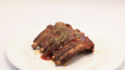 Fried pork ribs, barbecue, put in a white plate