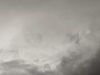 View of overcast sky. Dramatic gray sky and white clouds before rain in rainy season. Cloudy and moody sky. Storm sky. Cloudscape. Gloomy and moody background.