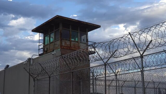 Prison Tower and Barbed Wire Fence