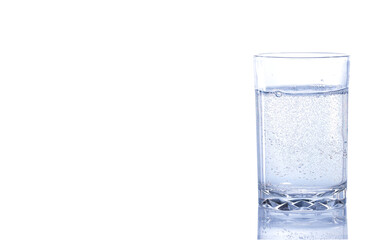 Glass of mineral water with bubbles isolated on white background. 