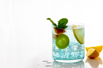 mojito cocktail with lime and fresh mint isolated on white background.