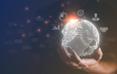 Technology concept, businessman holding virtual earth on hand, internet global business connection and high technology application and digital marketing. Online communication system and big data.