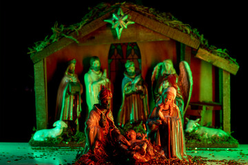Nativity scene with figures. A Christmas scene with baby Jesus, Mary and Joseph in the manger....