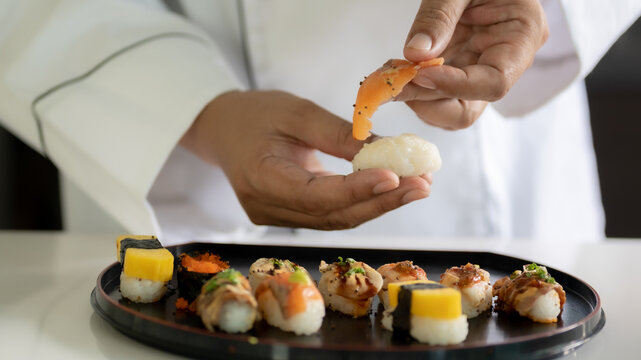 Chef cooking sushi in the kitchen