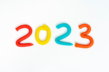 Numbers 2023 made out of play dough, play clay (plasticine). Holiday Art Activity for Kids. New Year 2023. Merry christmas concept