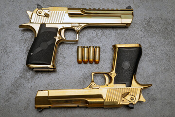 Powerful pistols in gold color caliber 50AE.