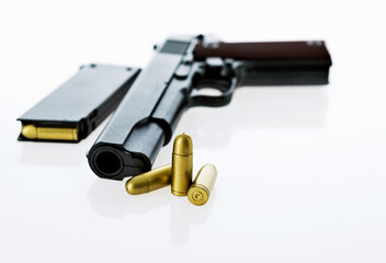 Gun with ammunition isolated on white background