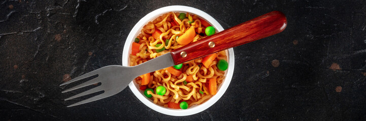Ramen cup, instant soba noodles in a plastic cup with vegetables