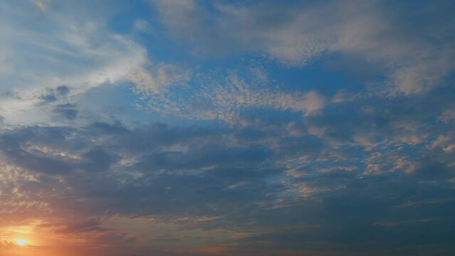 Sunset sky natural background. Big bright sun moves down on horizon. Timelapse.