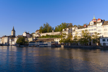 Scenic view of the old town of City of Zürich with Limmat River and historic houses on a sunny late summer morning. Photo taken September 22nd, 2022, Zurich, Switzerland.